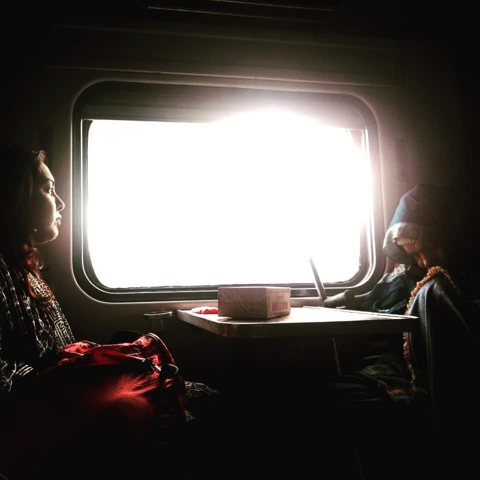Female traveler on a train journey in Pakistan