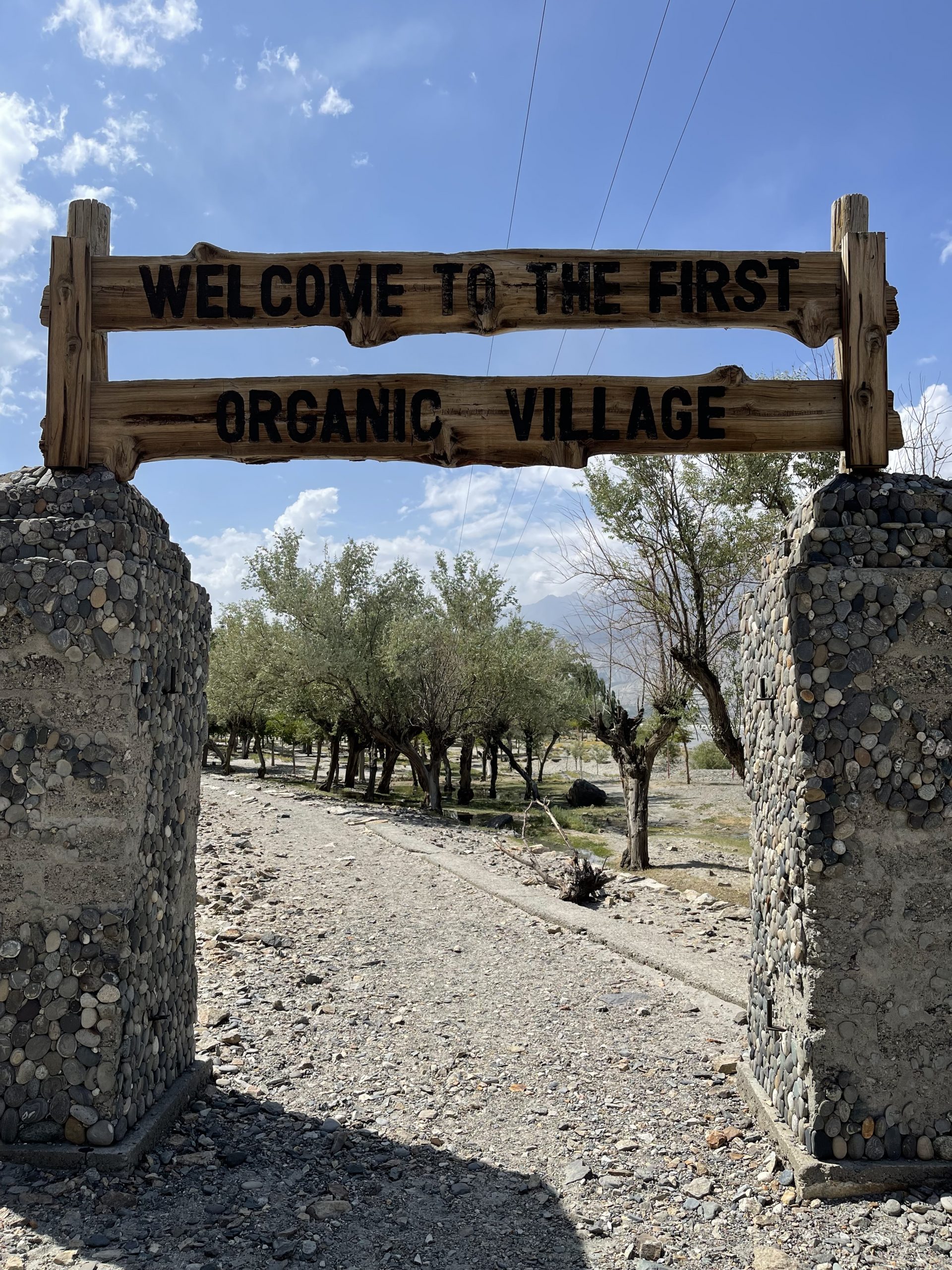 Wooden signboard at the entrance of organic village in Skardu