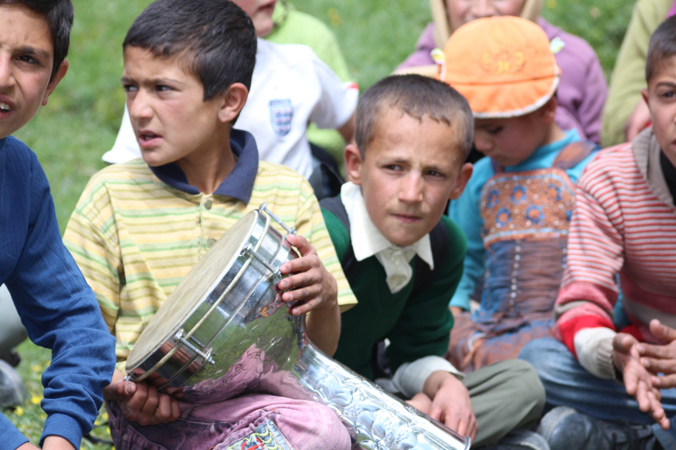 local kids playing music in Hunza