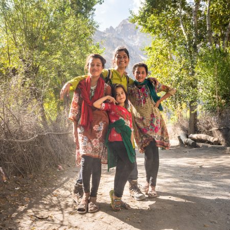 Female tourist with local kids in Ghizer - Gilgit Baltistan